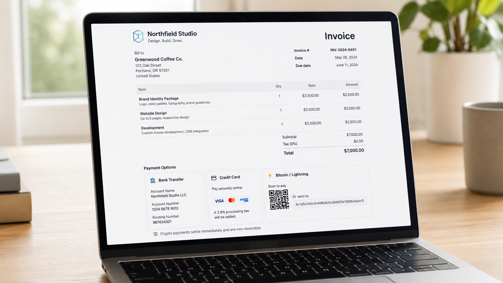 Invoice template on a laptop screen showing a payment options section with bank transfer, credit card, and Bitcoin or Lightning options